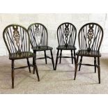 Four vintage wheel backed kitchen chairs