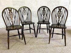 Four vintage wheel backed kitchen chairs
