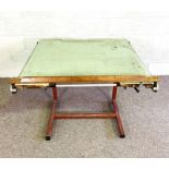 A vintage iron framed Architects table, 20th century, with weight an pulley driven slide rule, and