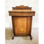 A Victorian walnut and inlaid Davenport, circa 1890, with a fall front and cabinet under, 79cm high