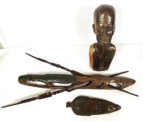 An African carved bust of a man smoking a pipe, hardwood, mid 20th century, 50cm high; together with