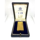 A Vintage Dunhill ‘70’ gold plated gas lighter, with engine turned decoration, in a fitted case,