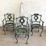 A set of vintage Coalbrookdale style garden chairs, with painted pressed seats and backs, scroll
