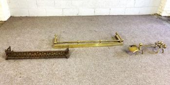 A Victorian brass fire curb, with ball and bar rail, 130cm wide; a set of brass fire irons and