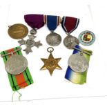 A group of military and British awards, including a silver MBE, hallmarked London 1927, on a bar