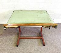 A vintage iron framed Architects table, 20th century, with weight an pulley driven slide rule, and