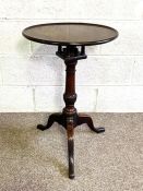 A George III mahogany snap top wine table, 18th century, the circular top with birdcage mount and