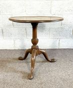 A provincial George II mahogany wine table, mid 18th century, with circular top and set on a
