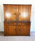 A large late Victorian varnished pine Housekeepers cupboard, circa 1900, with large cupboard doors