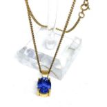A large pale blue sapphire pendant, with 9 carat gold pendant, the oval cut sapphire, set in