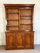 A mid Victorian mahogany bookcase, circa 1860 (en-suite with following lot), the top with two