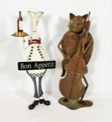 Two decorative ornaments, including a painted metal café figure of a chef; also a Jazz cat playing a