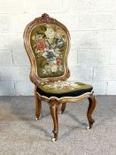 A Victorian walnut nursing chair, circa 1860, with spoon back and tapestry and beadwork