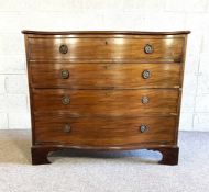 A late Regency mahogany serpentine front chest of drawers, circa 1820, with four long drawers on