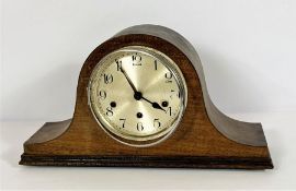 A group of assorted items including a vintage mantel clock; a modern table sculpture of a figure
