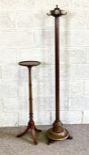 A vintage mahogany coat stand, early 20th century, with fluted pole and rotating top with brass