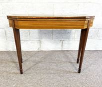A George IV mahogany tea table, circa 1825, with a foldover top and canted corners, on four