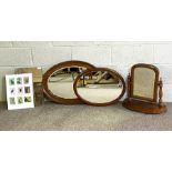 A vintage oval chequer moulded wall mirror; together with another plain moulded oval mirror; a
