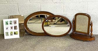 A vintage oval chequer moulded wall mirror; together with another plain moulded oval mirror; a