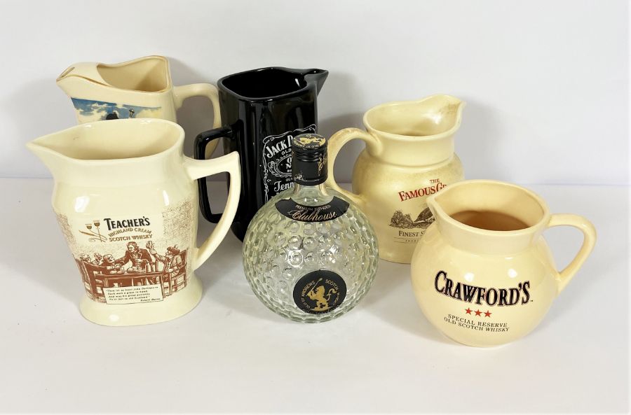 A small group of Whisky collectors water jugs, including Dewar’s White Label, Teachers and
