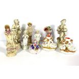 A group of assorted bone china and pottery figures, including Royal Doulton, and a spill vase with