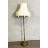 A vintage brass extending lamp stand, with paw feet, now fitted for electricity (not tested),