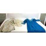 Two boxes and suitcase of assorted mixed textiles, including a vintage blue dress and other clothing