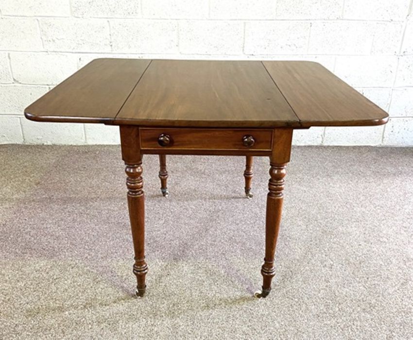 A mahogany Pembroke table, late 19th century, with a rounded drop leaf top, a single end drawer - Image 4 of 6