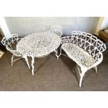 A vintage garden bench, table and two matching armchairs, Victorian style, with scrolled trellis
