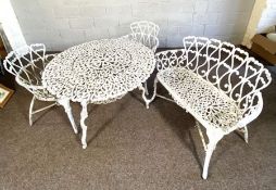 A vintage garden bench, table and two matching armchairs, Victorian style, with scrolled trellis