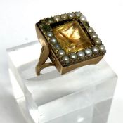 A 19th century pearl and quartz gentleman’s ring, with unmarked yellow metal setting, ring size P,