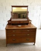 An Edwardian dressing chest, with rectangular mirrored top, 156cm high, 122cm wide; together with an
