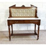 A Victorian stone topped washstand with decorative floral tiled back and turned legs, 122cm high,