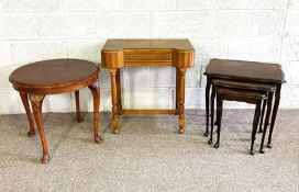 A nest of three occasional tables, also a small mahogany veneered coffee table and a vintage low