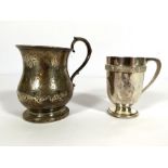 A small Victorian silver baluster mug, hallmarked London 1860, with S scroll side handle; also