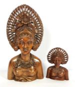 A Balinese carved figure of a woman, in traditional headdress, 20th century, half length, 41cm high;