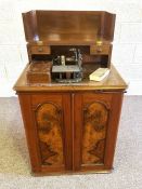 A rare American Wheeler & Wilson treadle sewing machine, in a Victorian mahogany cabinet, circa