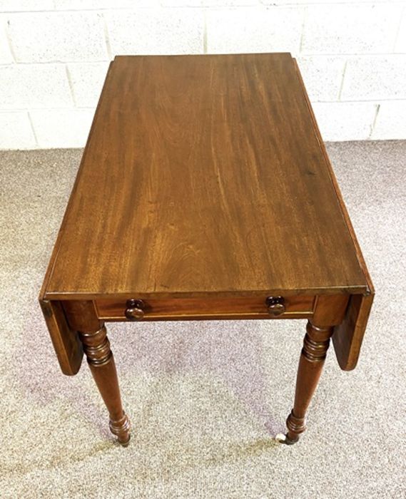 A mahogany Pembroke table, late 19th century, with a rounded drop leaf top, a single end drawer - Image 3 of 6