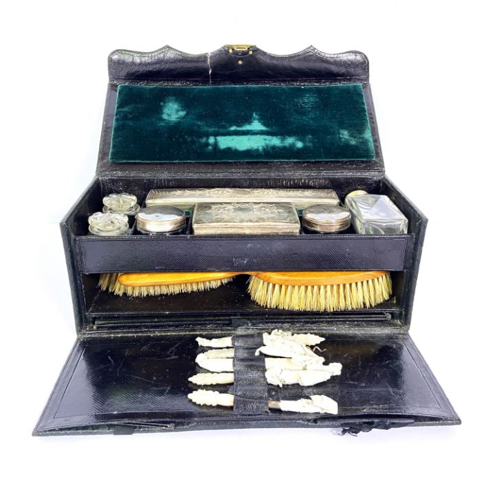 A small Victorian leather travelling necessaire vanity case, including assorted silver plate and - Image 3 of 6