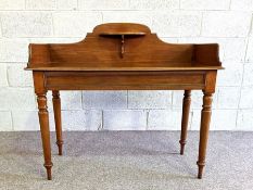 A mid Victorian mahogany washstand, circa 1870, with gallery back and over shelf, on turned legs,