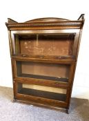 A Globe Wernicke style sectional bookcase, with gallery top