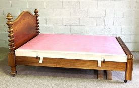 A Victorian mahogany 5 foot double bed, circa 1870, with an arched moulded headboard, spiral twist