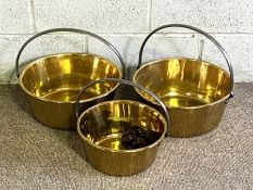 Three brass jam/ preserving pans, of typical form, with overhandles (3)