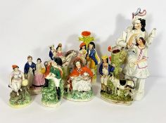 A group of assorted Staffordshire flatback pottery figures, including Napoleon; A man with his