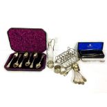 A small group of assorted silver, including a set of six cased tea spoons, a silver topped cruet