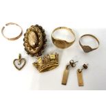 A small quantity of gold and costume jewellery, including a 9 carat gold ring, 5g; two more rings,
