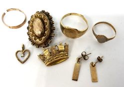 A small quantity of gold and costume jewellery, including a 9 carat gold ring, 5g; two more rings,