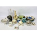 A group of assorted ceramics, including a Continental glass oil lamp base, a decorative bottle