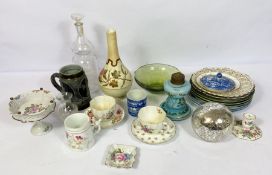 A group of assorted ceramics, including a Continental glass oil lamp base, a decorative bottle