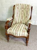 A Victorian mahogany easy chair, circa 1870, with scrolled over and button upholstered back and seat
